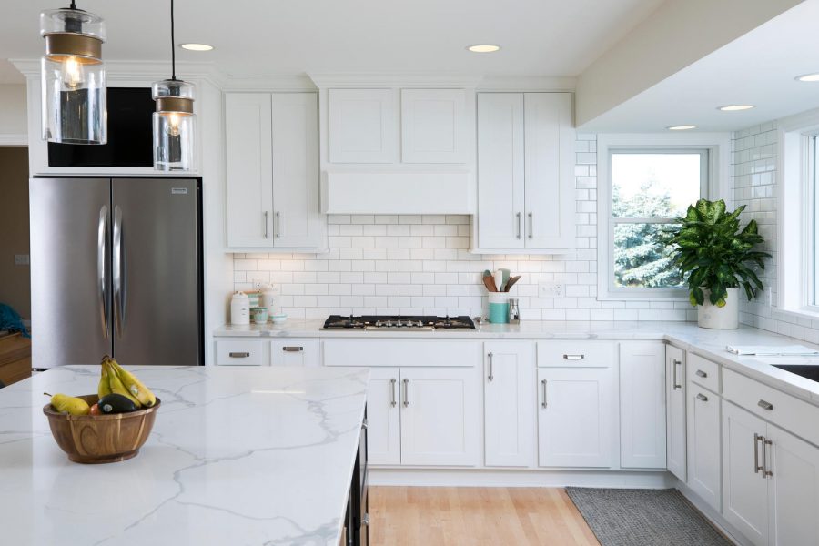 Kitchen with white cabinetry and quartz countertops