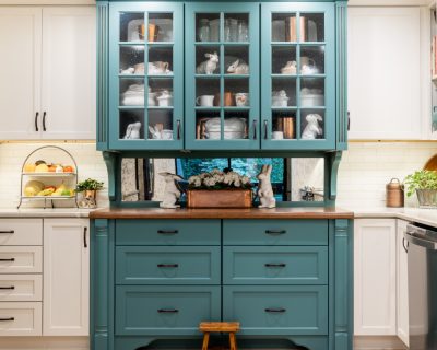 teal kitchen cabinets with glass cabinet doors